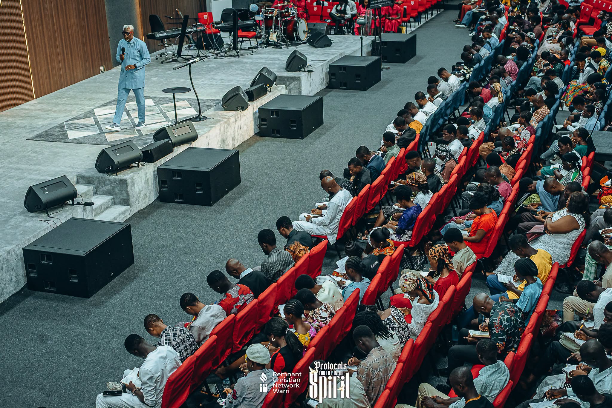 Believers gathered in discussion at The Conclave